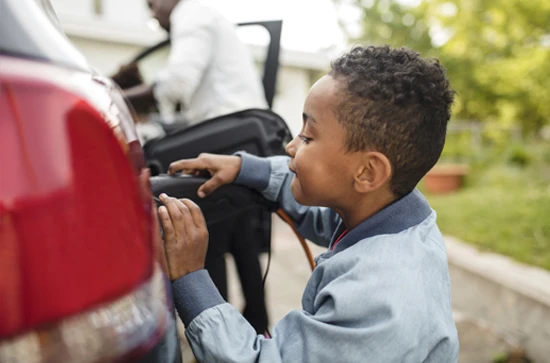 kid with electric car